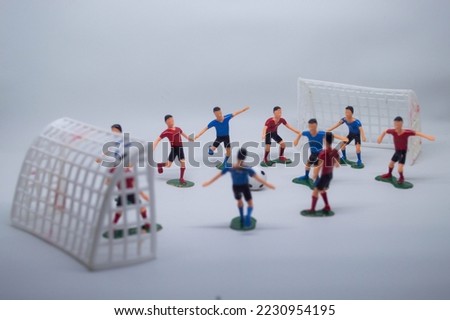 Football team toys on white background. Selective focus