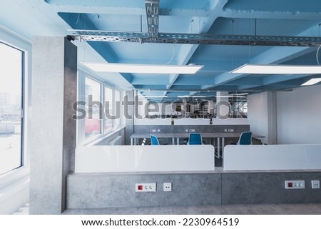 Photo of a modern office where programming, digital marketing and web design projects are done. Office with modern furniture and glass office