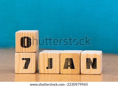 Cube shape calendar for January 07 on wooden surface with empty space for text,cube calendar for January on wood background Royalty-Free Stock Photo #2230979965