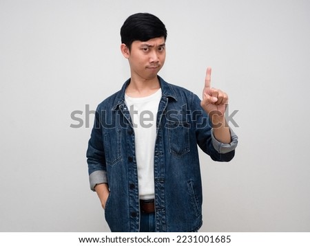 Positive man jeans shirt gesture show one finger up isolated Royalty-Free Stock Photo #2231001685