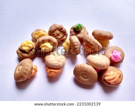 iced gem biscuits Cookies on Isolated white background. Crackers with artificial-colored sugar on top
