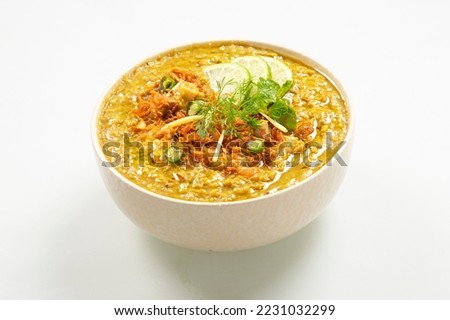 Top View Of Beef Haleem with naan, green background.Haleem with Spices and Herbs.Bangladeshi haleem. Royalty-Free Stock Photo #2231032299