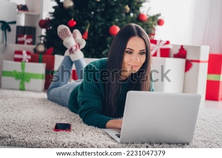 Photo of concentrated focused lady choose presents write sms message email greetings enjoy weekend magic day season house indoors