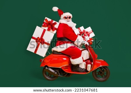Full size profile side photo of white grey hair bearded santa claus ride motorbike deliver x-mas christmas gifts on noel night wear headwear isolated bright shine color background