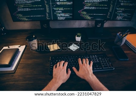 Photo of freelancer hands arms typing software code modern gadget work indoors workplace workstation loft