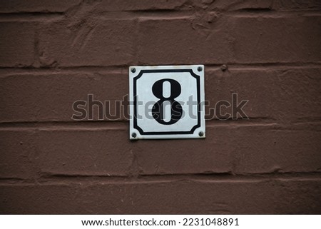 number 8  on a house, in Alfeld, Lower Saxony, Germany, October 2022