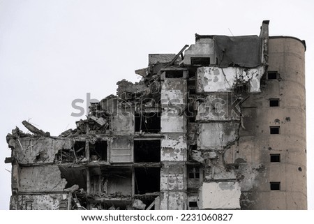 destroyed and burned houses in the city during the war in Ukraine Royalty-Free Stock Photo #2231060827