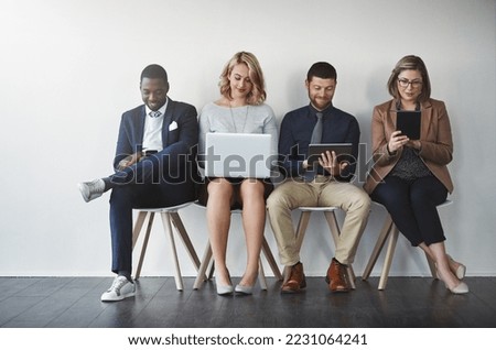 They were all shortlisted, they are experienced in the job. Studio shot of businesspeople waiting in line against a white background.