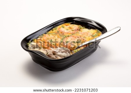 Dabba gosht

(Coming from the Bohra community is a succulent, melt in the mouth mutton delicacy in a white sauce topped with eggs and baked to perfection)

 Royalty-Free Stock Photo #2231071203