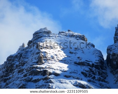 The first early autumn snow on the high alpine peaks above the Calfeisental alpine valley and in the UNESCO World Heritage Tectonic Arena Sardona (UNESCO-Welterbe Tektonikarena Sardona) - Switzerland