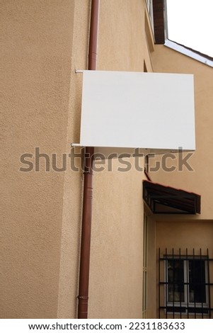 Blank white  signboard on the wall