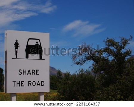 Share the road sign in the forest