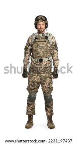 Soldier in Ukrainian military uniform with tactical goggles and headphones on white background
