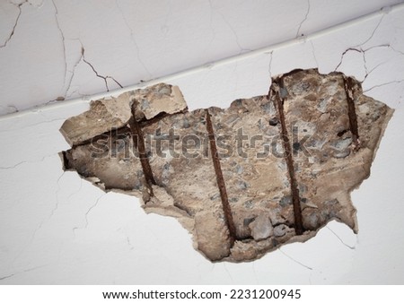 Concrete ceiling cracks inside an old building for many years. Royalty-Free Stock Photo #2231200945