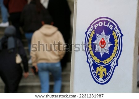 signage with police logo for regular people passage