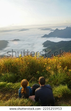 Tourists looking at the beautiful scenery at Phu Chi Fa Forest Park, Chiang Rai, Thailand                Royalty-Free Stock Photo #2231255913