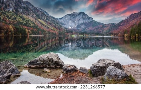 Fantastic Vivid nature landscape. Scenic image of Langbathsee lake during sunset. Popular travel and hiking destination. Picture of wild area. Awesome nature Background. Concept of ideal resting place