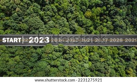 new year 2023 numbers on road drag tires Planning concept, goals, challenges, environment in 2023, bird's eye view. Royalty-Free Stock Photo #2231275921