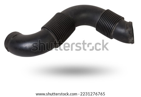 Air duct to the filter of intake manifold of the car engine from textured material and black plastic to condition the air and prevent dust from entering the passenger compartment. Sale of spare parts. Royalty-Free Stock Photo #2231276765
