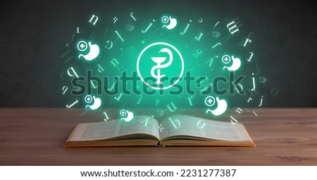 Open medical book with health icons above