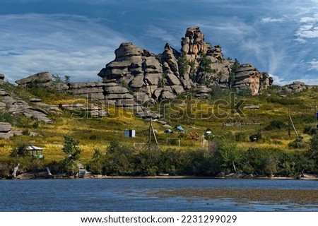 Russia. Altai Territory. Picturesque shores of Kolyvan Lake Kolyvan is surrounded by bizarre rocky ledges located near the border with Kazakhstan. This is an ideal place for novice climbers.
