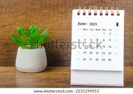 June 2023 Monthly desk calendar for 2023 year with plant pot. Royalty-Free Stock Photo #2231299051