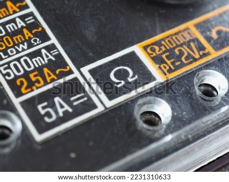 electrical symbols on a vintage analog multimeter measuring instrument Royalty-Free Stock Photo #2231310633