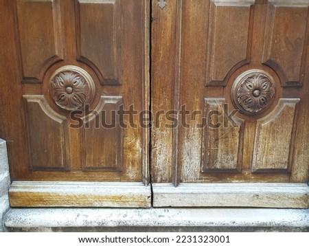 Antique style wooden door handles knocks house old town decorative details entrance impressive romantic historic