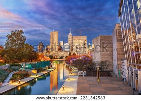 Indianapolis, Indiana, USA downtown cityscape over the river walk at twilight.