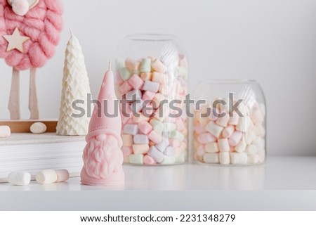 Christmas background with candle trees, moose and colorful marshmallows. White background. New year decoration concept.