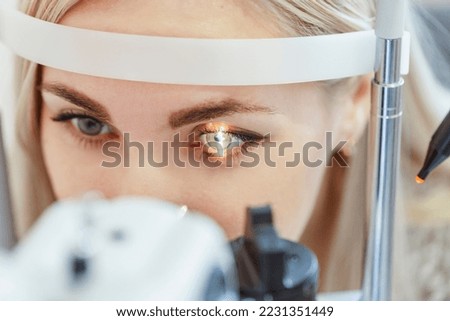 eye examination by an ophthalmologist Royalty-Free Stock Photo #2231351449