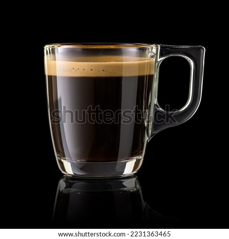 Full cup of espresso coffee isolated on black background. Royalty-Free Stock Photo #2231363465
