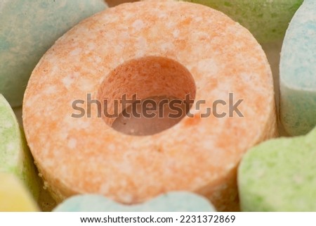 
Powdered baby candies on a white background