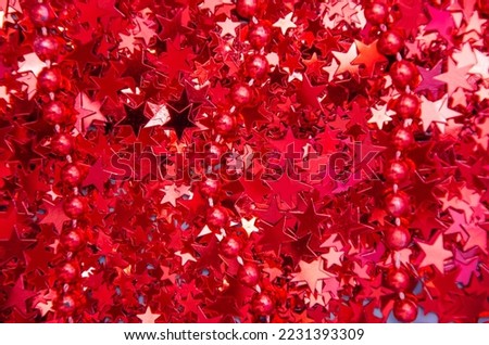Abstract background with sparkling red confetti in shape of star 