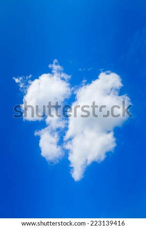 Clouds like broken heart on blue-sky