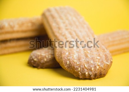 Delicious sugar cookies on a yellow background
