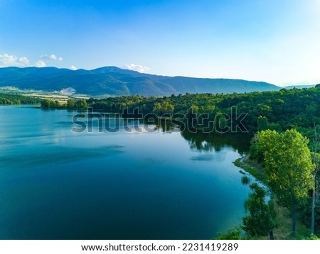 Breeding of freshwater fish in lake with round nets. Rhodope mountains, Europe Royalty-Free Stock Photo #2231419289