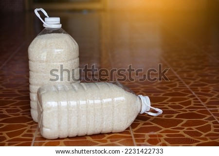 Two plastic bottles that contain grains of rice to prevent from dust or insects. DIY. Concept, reuse plastic bottle. Zero waste.                  Royalty-Free Stock Photo #2231422733