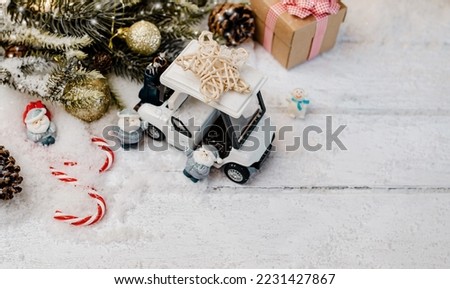 Christmas decoration with golf car and gift for winter season on 25 December.