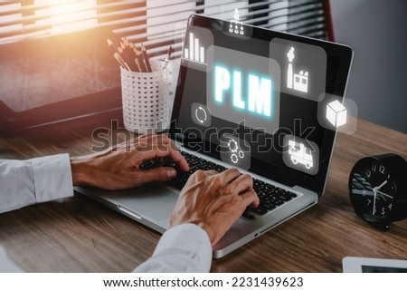 PLM - In industry, product lifecycle management concept, Person hand using laptop computer on desk with PLM icon on virtual screen, program development, Technology, Internet and network.