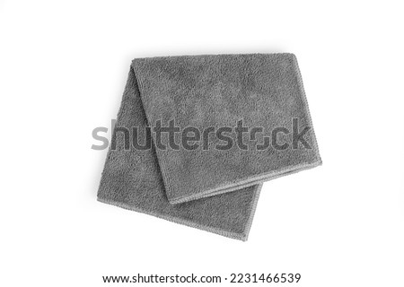 Gray micro fiber towel isolated on white background. Royalty-Free Stock Photo #2231466539