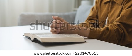 Religion and believe, faith christian woman holding holy bible book in hand, peace and hope of humble. Pray, prayer person meditating, praying to request God, jesus asking for help, spiritual concept. Royalty-Free Stock Photo #2231470513