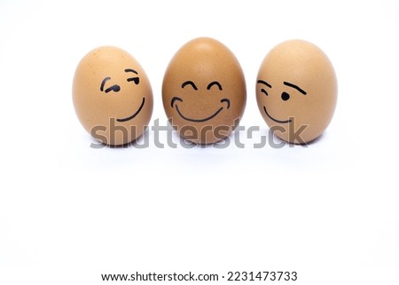 Two eggs flirting and one very happy 2