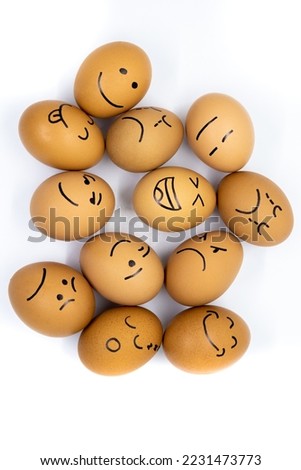 
Twelve eggs with different moods on white background
