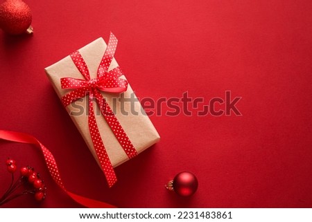 Christmas gifts, boxing day and traditional holiday presents flat lay, classic xmas gift boxes on red background, wrapped present with festive ornaments and decorations for holidays flatlay design Royalty-Free Stock Photo #2231483861