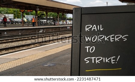 Rail workers to Strike! written on a sign at a train station Royalty-Free Stock Photo #2231487471