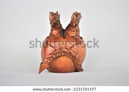 Wooden Baby Dragon Statue Handmade Bali Baby Dragon Wood Carving, Sculpture, Art from Bali Indonesia Royalty-Free Stock Photo #2231501197