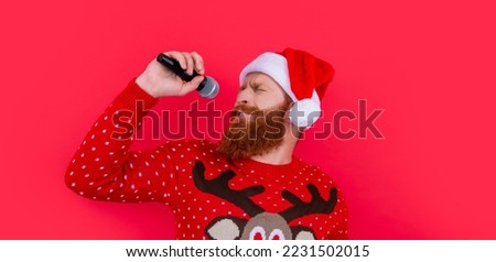christmas karaoke music. emotional man singing christmas music in karaoke. christmas santa man