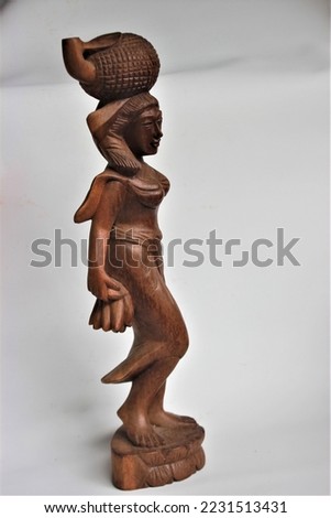 Balinese Girl Wood Carving, Wooden Statue, Wood Sculpture, Hand Made, Art from Bali Indonesia Royalty-Free Stock Photo #2231513431