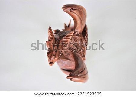 	
Wooden Dragon Sculpture Handmade Bali Wood Carving, Sculpture, Art from Bali Indonesia Royalty-Free Stock Photo #2231523905